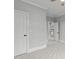 Neutral bedroom with a ceiling fan and multiple doorways at 6004 Brass Tack Ct, Fuquay Varina, NC 27526