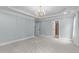 Large bedroom with ensuite bathroom, neutral walls and carpet, and ample natural light at 6004 Brass Tack Ct, Fuquay Varina, NC 27526