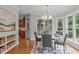 Dining area with large windows offering natural light and views of the green outdoors at 6004 Brass Tack Ct, Fuquay Varina, NC 27526