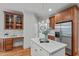 Bright kitchen featuring white countertops, stainless steel refrigerator, and custom cabinets at 6004 Brass Tack Ct, Fuquay Varina, NC 27526