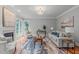 Inviting living room with fireplace, large windows, hardwood floors, and ample seating at 6004 Brass Tack Ct, Fuquay Varina, NC 27526