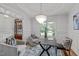 Bright office space with white walls, statement lighting, a modern desk, and plush chairs for comfort at 6004 Brass Tack Ct, Fuquay Varina, NC 27526