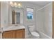 Neutral bathroom with oak vanity, marble countertop, and a shower-tub combination at 6221 Winter Spring Dr, Wake Forest, NC 27587