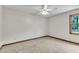 Spacious bedroom features a ceiling fan, plush carpet, and neutral walls and trim at 6221 Winter Spring Dr, Wake Forest, NC 27587