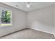 Bedroom featuring neutral walls, plush carpet, a ceiling fan, and backyard views at 6221 Winter Spring Dr, Wake Forest, NC 27587