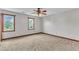 Bedroom with neutral walls, plush carpet, wood trim, and natural light at 6221 Winter Spring Dr, Wake Forest, NC 27587