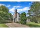 Two-story home with a brick chimney, and long driveway at 6221 Winter Spring Dr, Wake Forest, NC 27587