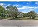 View of home with landscaped front yard and sidewalks in a suburban neighborhood at 6221 Winter Spring Dr, Wake Forest, NC 27587