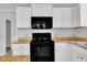 Functional kitchen features a built-in oven, microwave, and plentiful cabinet storage at 6221 Winter Spring Dr, Wake Forest, NC 27587