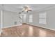 Bright living room featuring beautiful wood floors and a staircase at 6221 Winter Spring Dr, Wake Forest, NC 27587