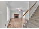 Spacious living room featuring a brick fireplace and wood-look flooring at 6221 Winter Spring Dr, Wake Forest, NC 27587