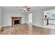 Inviting living room with a fireplace and an open doorway to the kitchen at 6221 Winter Spring Dr, Wake Forest, NC 27587