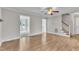 Inviting living room with wood flooring and a ceiling fan for added comfort at 6221 Winter Spring Dr, Wake Forest, NC 27587