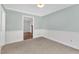 Comfortable living room featuring neutral decor and soft carpeting at 6221 Winter Spring Dr, Wake Forest, NC 27587