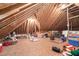 Spacious attic provides ample storage under the roofline, with plenty of room for storage containers and other household items at 65 Georgetown Woods Dr, Youngsville, NC 27596