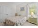 Bright bedroom with carpet, and a large window that provides natural light at 65 Georgetown Woods Dr, Youngsville, NC 27596