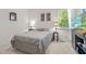 Bedroom featuring a fish tank, a window, and carpet flooring at 65 Georgetown Woods Dr, Youngsville, NC 27596