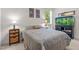 Bedroom featuring a fish tank, a window, and carpet flooring at 65 Georgetown Woods Dr, Youngsville, NC 27596