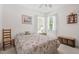 Cozy bedroom with carpet, a ceiling fan, and large windows that provide natural light at 65 Georgetown Woods Dr, Youngsville, NC 27596