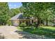 Well-maintained home with an attached garage and meticulously landscaped yard at 65 Georgetown Woods Dr, Youngsville, NC 27596