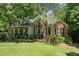 Charming brick home featuring a well-manicured lawn and lush landscaping at 65 Georgetown Woods Dr, Youngsville, NC 27596