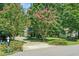 Well-maintained home with an attached garage and meticulously landscaped yard at 65 Georgetown Woods Dr, Youngsville, NC 27596