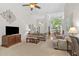 Spacious living room with high ceilings, large windows, and comfortable seating at 65 Georgetown Woods Dr, Youngsville, NC 27596