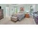 Comfortable main bedroom with a tray ceiling, soft blue walls, and coordinated furnishings at 65 Georgetown Woods Dr, Youngsville, NC 27596