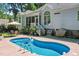 Inviting private pool with a concrete deck surrounded by mature trees at 65 Georgetown Woods Dr, Youngsville, NC 27596