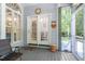 Inviting screened porch with seating area and tranquil views of the surrounding landscape at 65 Georgetown Woods Dr, Youngsville, NC 27596
