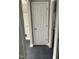 Hallway leading to bathroom featuring modern tile flooring at 713 Champion St, Henderson, NC 27536