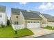 Back exterior of home with green grass and white fence at 732 Keystone Park Dr, Morrisville, NC 27560