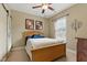 This cozy bedroom features a queen size bed, ceiling fan and natural light at 732 Keystone Park Dr, Morrisville, NC 27560