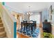 This dining room showcases a chair-height table, decorative rug, and stairs at 732 Keystone Park Dr, Morrisville, NC 27560