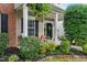 Charming front porch with comfortable seating and lovely landscaping at 732 Keystone Park Dr, Morrisville, NC 27560