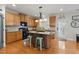 Well-equipped kitchen with light wood cabinets, a central island, and modern appliances at 732 Keystone Park Dr, Morrisville, NC 27560