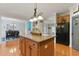 Open kitchen layout with a center island, stainless steel appliances, and ample counter space at 732 Keystone Park Dr, Morrisville, NC 27560