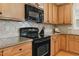 Kitchen with black oven and microwave, with a nice cabinet and countertop at 732 Keystone Park Dr, Morrisville, NC 27560