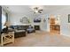 Spacious living room with a fireplace, comfortable seating, and an open layout to the kitchen at 732 Keystone Park Dr, Morrisville, NC 27560