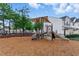 Community playground on mulch with a small train and slide at 732 Keystone Park Dr, Morrisville, NC 27560
