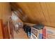 Spacious attic storage area with sloped ceilings and storage boxes at 7605 Pats Branch Dr, Raleigh, NC 27612