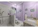 Modern bathroom with gray stone shower and vanity with granite countertop at 7605 Pats Branch Dr, Raleigh, NC 27612