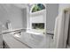 Bright bathroom featuring a soaking tub with jets and a large window for natural light at 7605 Pats Branch Dr, Raleigh, NC 27612