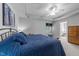 Relaxing bedroom offers a tray ceiling, large window, sitting bench, and ensuite bath at 7605 Pats Branch Dr, Raleigh, NC 27612
