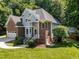 Beautiful two-story home with brick and siding, manicured lawn and landscaping, in a desirable location at 7605 Pats Branch Dr, Raleigh, NC 27612