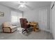 Home office featuring carpet, ceiling fan, window, and traditional wooden desk at 7605 Pats Branch Dr, Raleigh, NC 27612