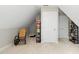 Cozy finished attic space with storage, carpeted floor, and natural light at 800 Highgrove Dr, Chapel Hill, NC 27516
