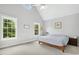 Bright bedroom boasts large windows, vaulted ceilings, and neutral color palette at 800 Highgrove Dr, Chapel Hill, NC 27516
