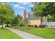 Exterior view showcasing the house, landscaped lawn, mature trees, and well-maintained sidewalk at 800 Highgrove Dr, Chapel Hill, NC 27516