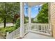 Relaxing front porch features a classic swing and serene views of the neighborhood, perfect for unwinding at 800 Highgrove Dr, Chapel Hill, NC 27516